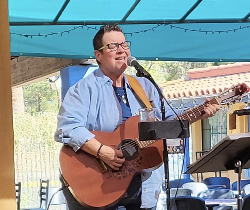 Tucson Musician Spotlight: Sabra Faulk 4 Sabra Faulk singing and player guitar at Monterey Court