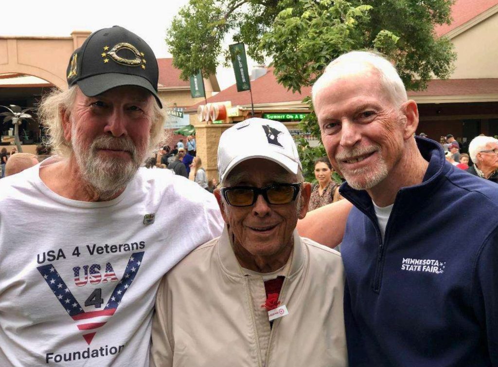 Bill Kruschel, a 100-year old Veteran, served as a Navy Corpsman in the Pacific sang the National Anthem for us 3 times in 2025. This is from the November event. The next one will be Bill in the center between me and Jerry Hammer, retired CEO of the MN State Fair at the Veterans Appreciation Day in August 2025. Jerry was so impressed that he invited Bill back for 2026.