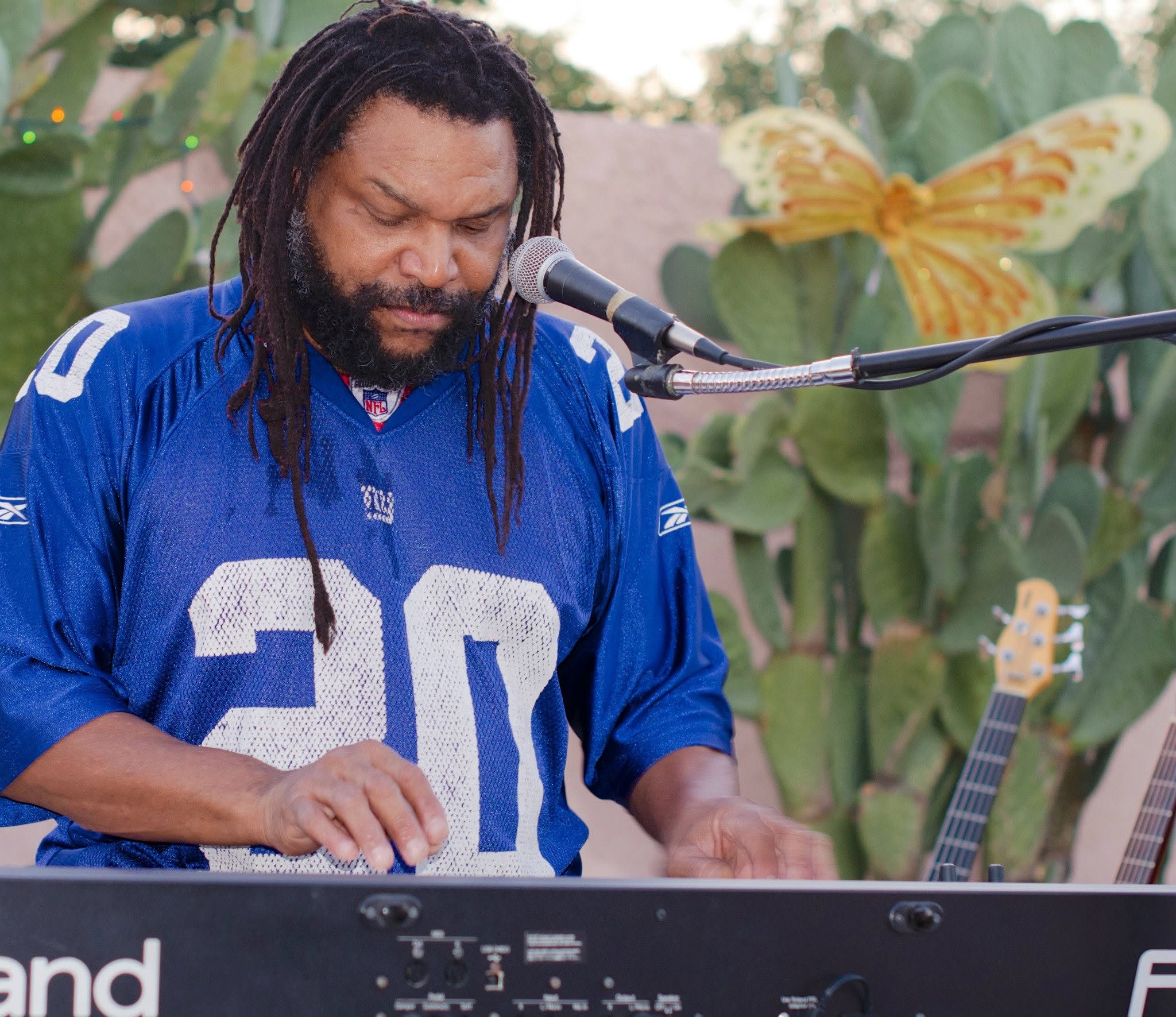 Tucson Musician Spotlight: Amochip Dabney 8 Amochip Dabney playing keyboard at an outdoor Tucson show, 2012. Photo by Woody Jester.