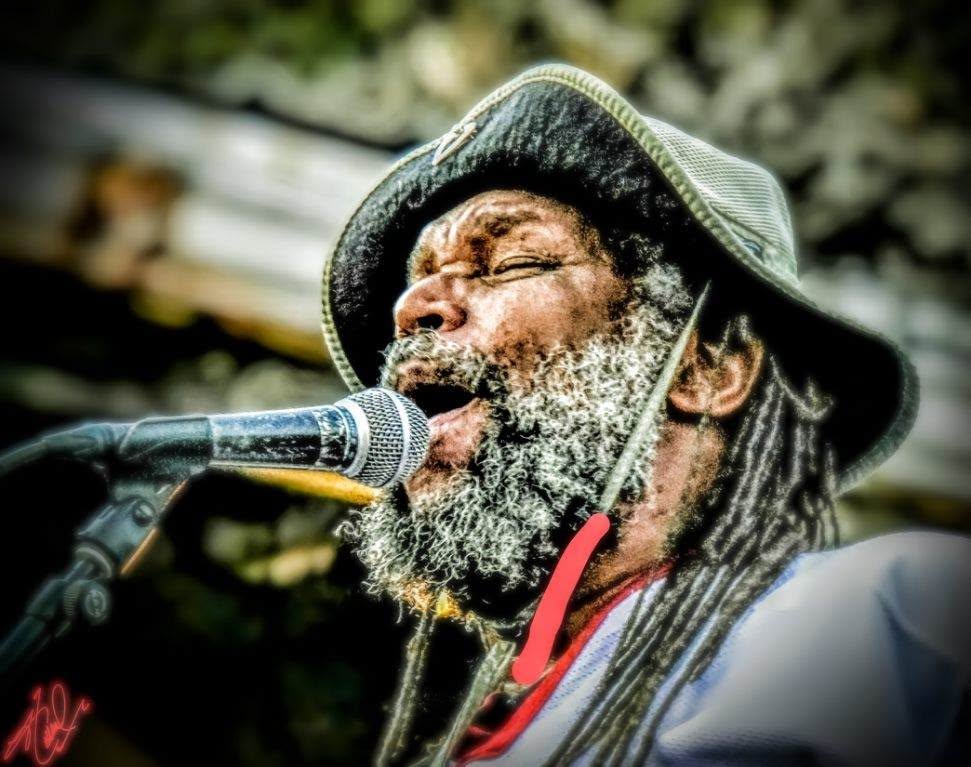 Tucson Musician Spotlight: Amochip Dabney 24 Amochip Dabney mid-performance, close-up on stage, photo by John Holland.